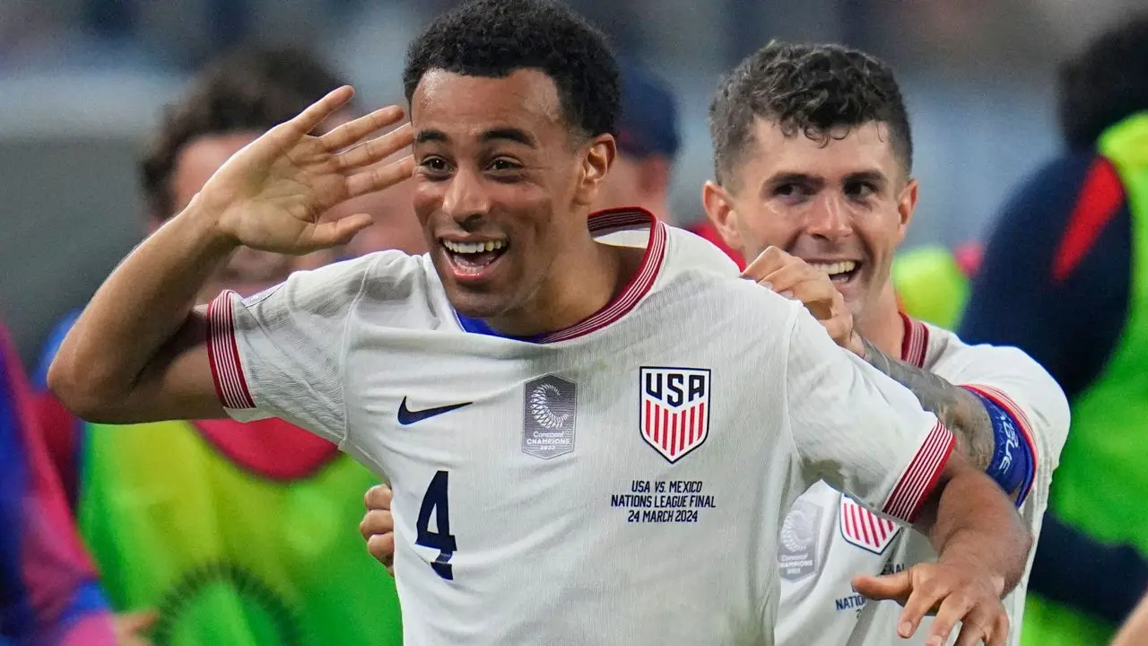 Tyler Adams celebrates