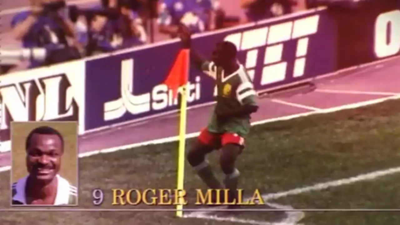Roger Milla celebrates by dancing at the corner flag