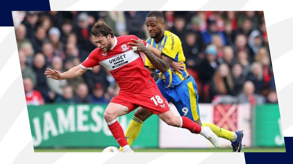 aiden morris holds off southampton player during championship playoff