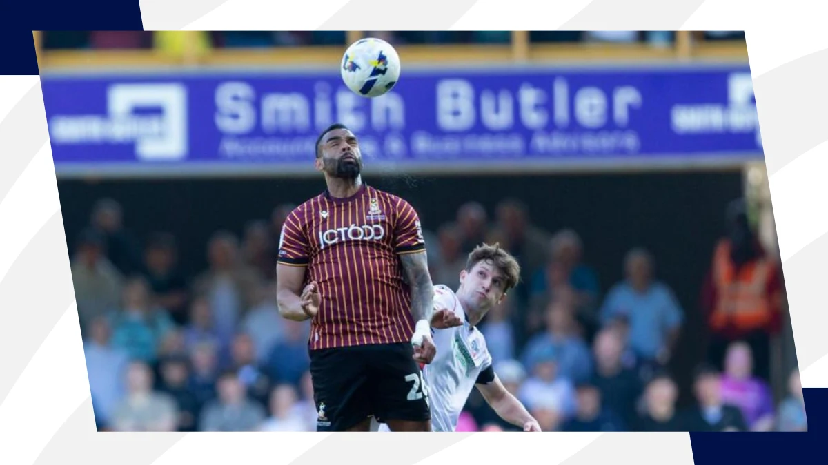 curtis tilt heads the ball during league one game