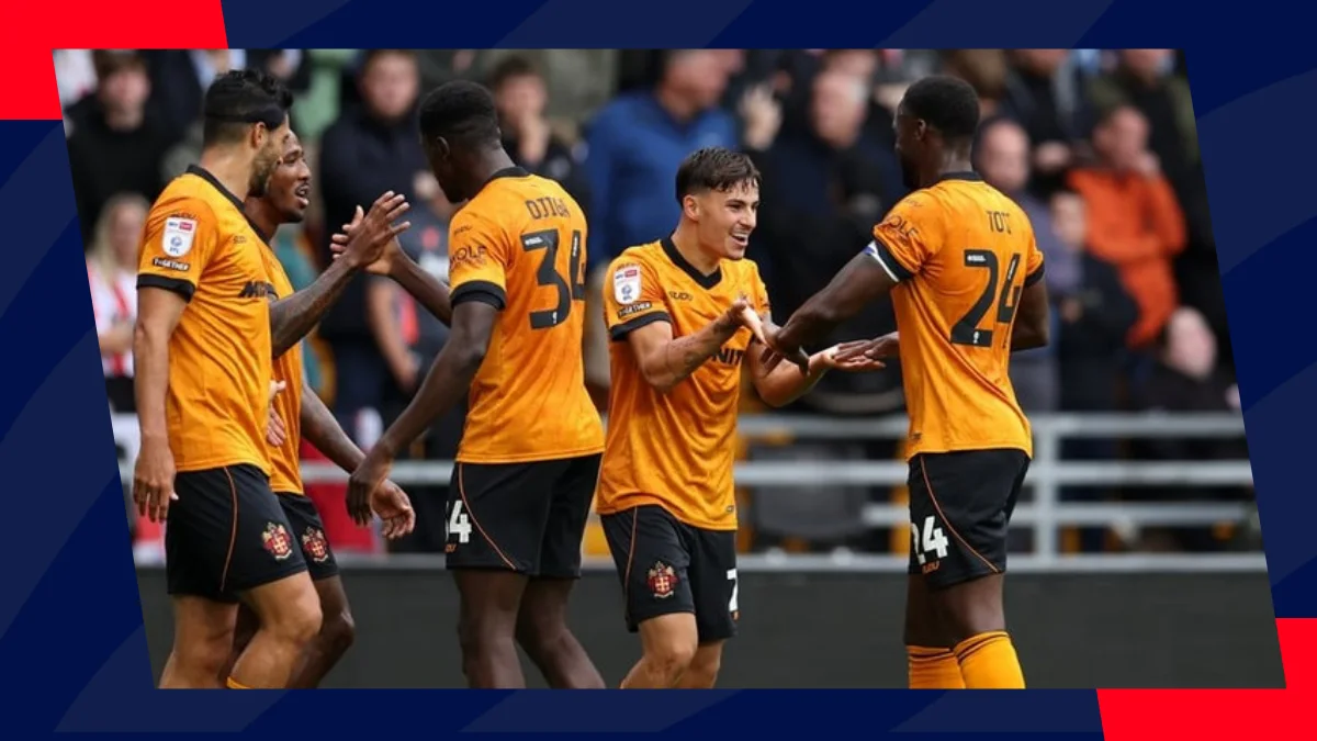 wolves players celebrate teammate's goal