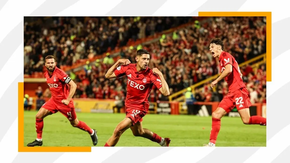 Aberdeen football players celebrating goals