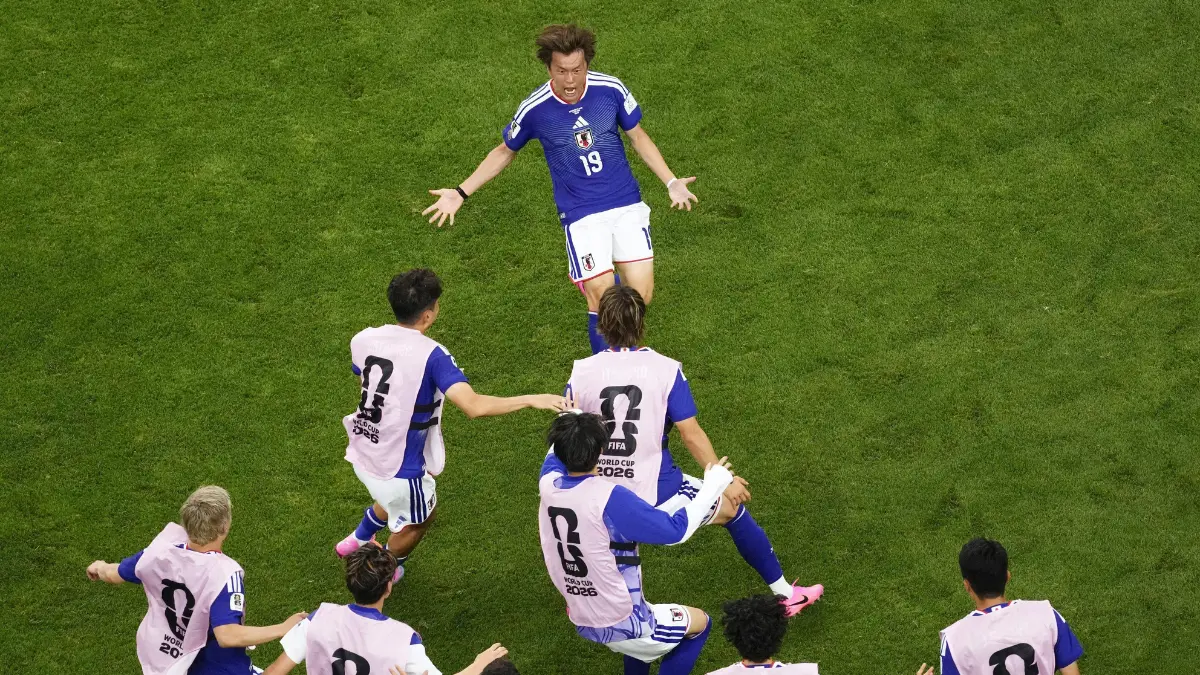 japan celebrates after scoring a goal